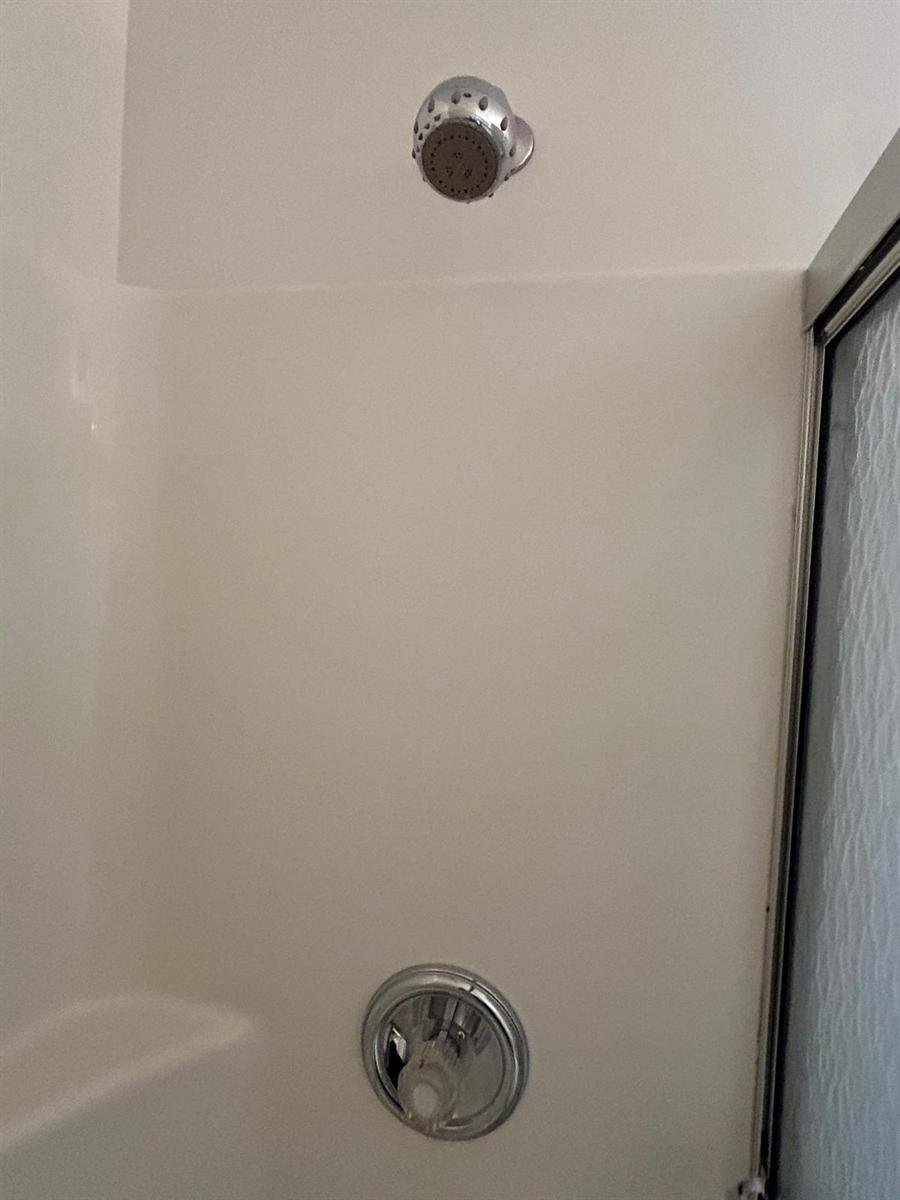 Shower walls and fixtures scrubbed clean
