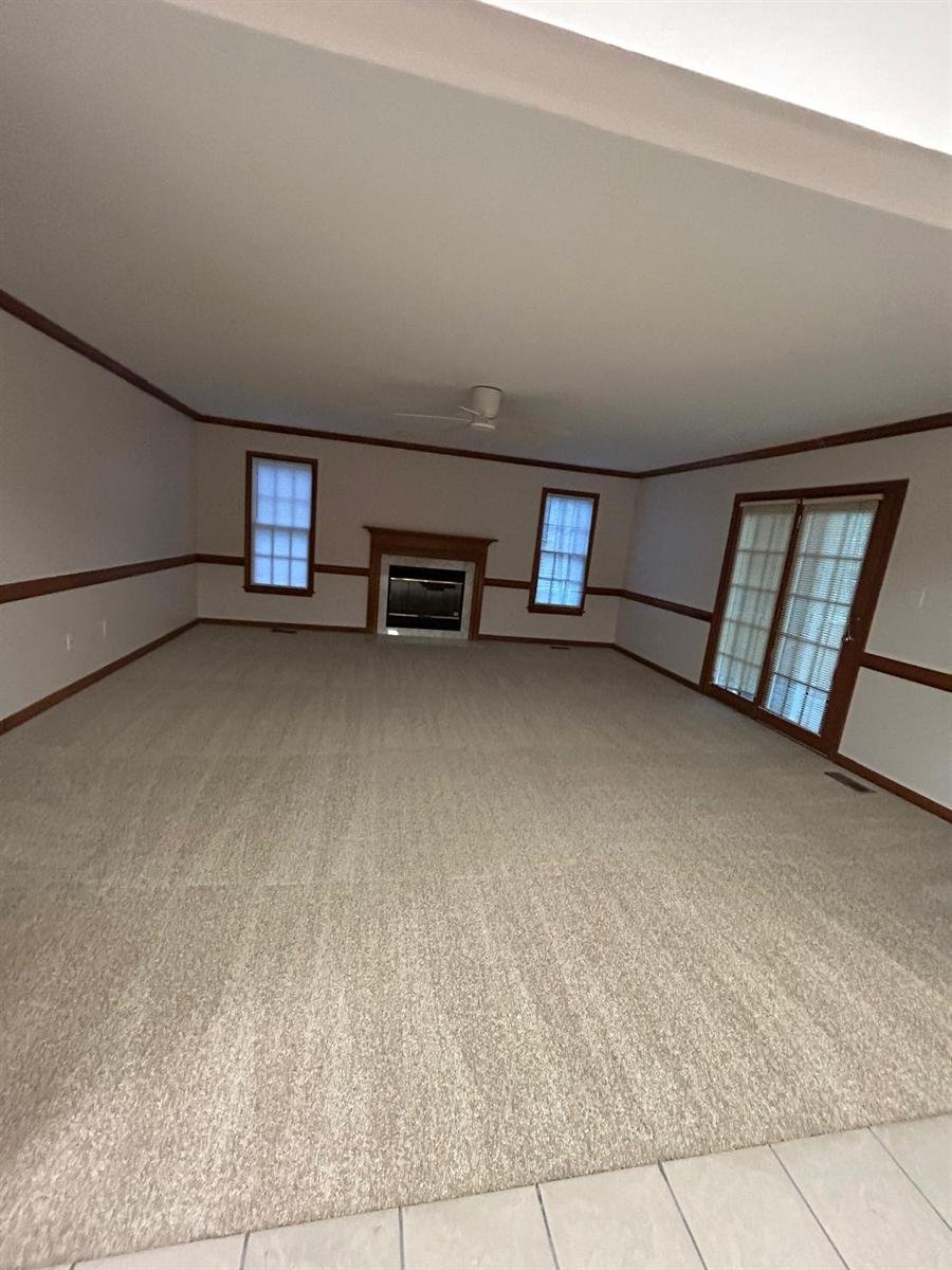 Large living room vacuumed and ready for move-in